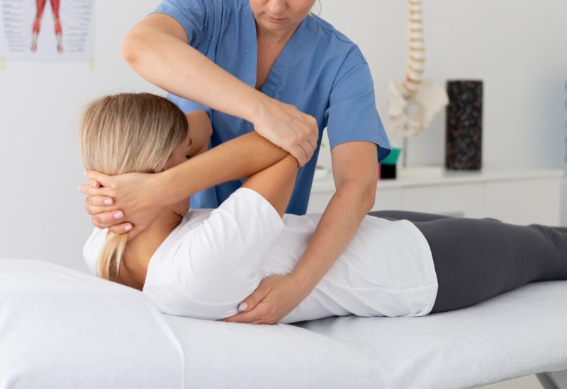 physiotherapist-helping-young-female-patient